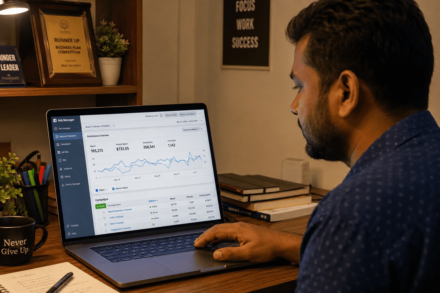 A Bangladeshi small business owner looking at a laptop screen showing Facebook Ads Manager
